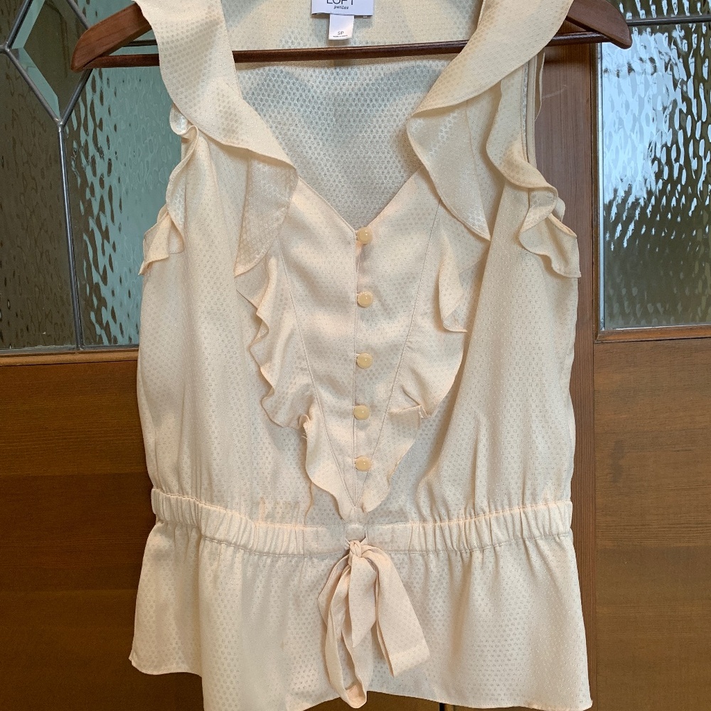 Cream sleeveless top